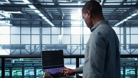 server farm employee using artificial intelligence tech on devices