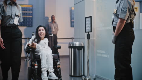 airport security and assistance for a passenger in a wheelchair
