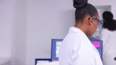 Scientist,-black-woman-and-microscope