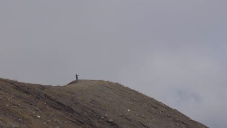 hiker at edge of the volcano crater santa ana in el salvador high altitude