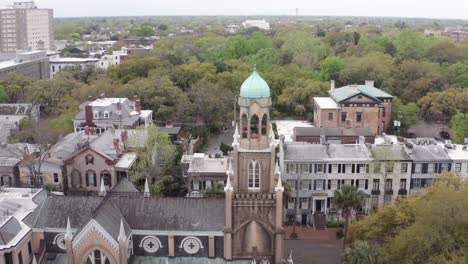 Descending-close-up-aerial-shot-of-the-ornate-dome-atop-the-Congregation-Mickve-Israel-Temple-in-downtown-Savannah,-Georgia