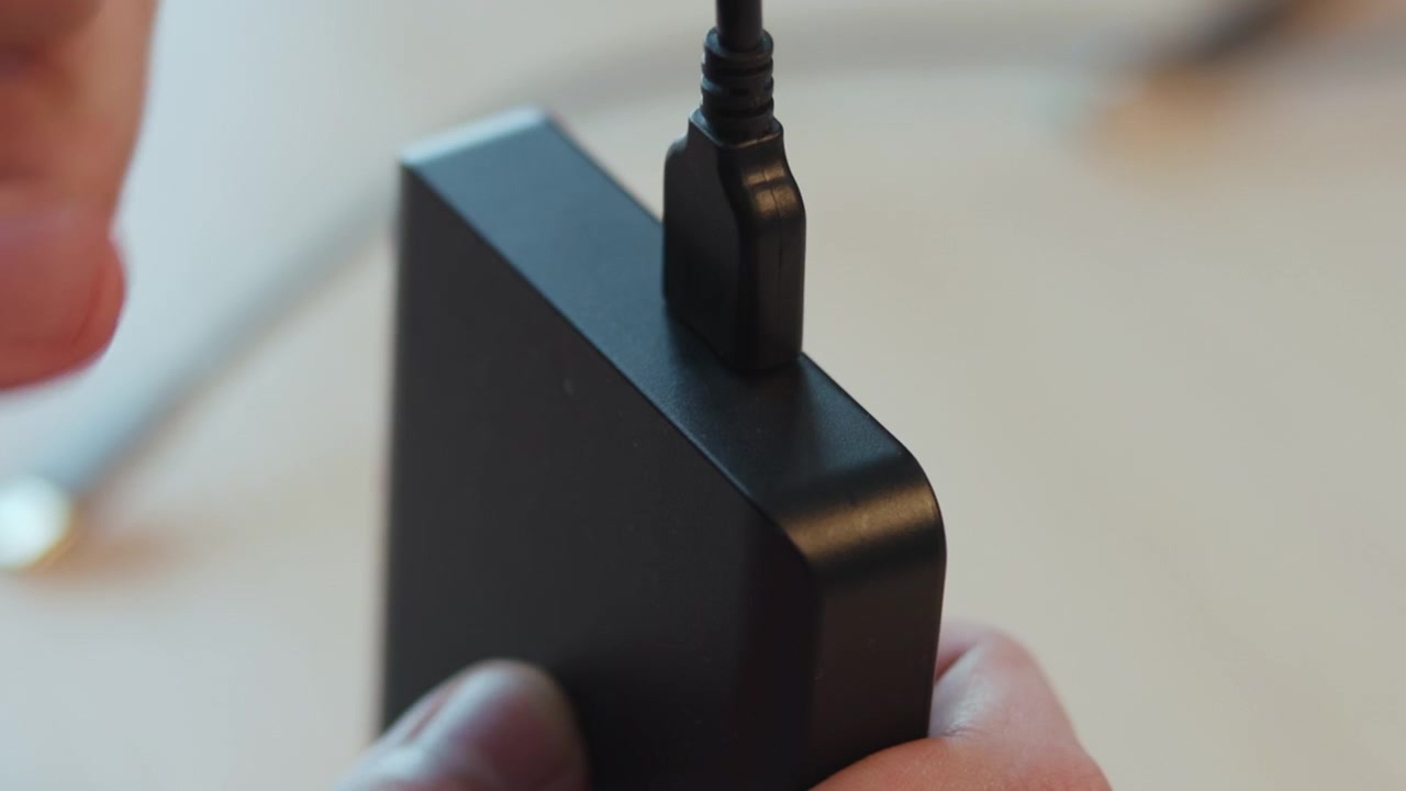 White Hand Connecting Usb Cable To Black Adapter, Stepwise Closeup On Insertion And Secure Fit, Instructional