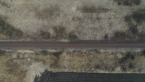 Sky-view-of-a-rail-track-with-train-Hungary-in-winter