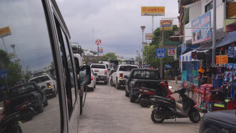 car traffic in mexico village, authentic town in latin america, view from taxi