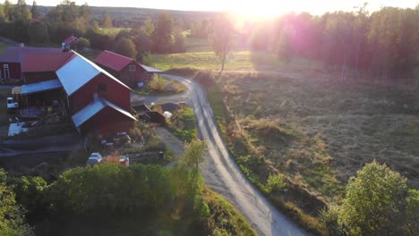 drone footage flying over a small farm in sweden