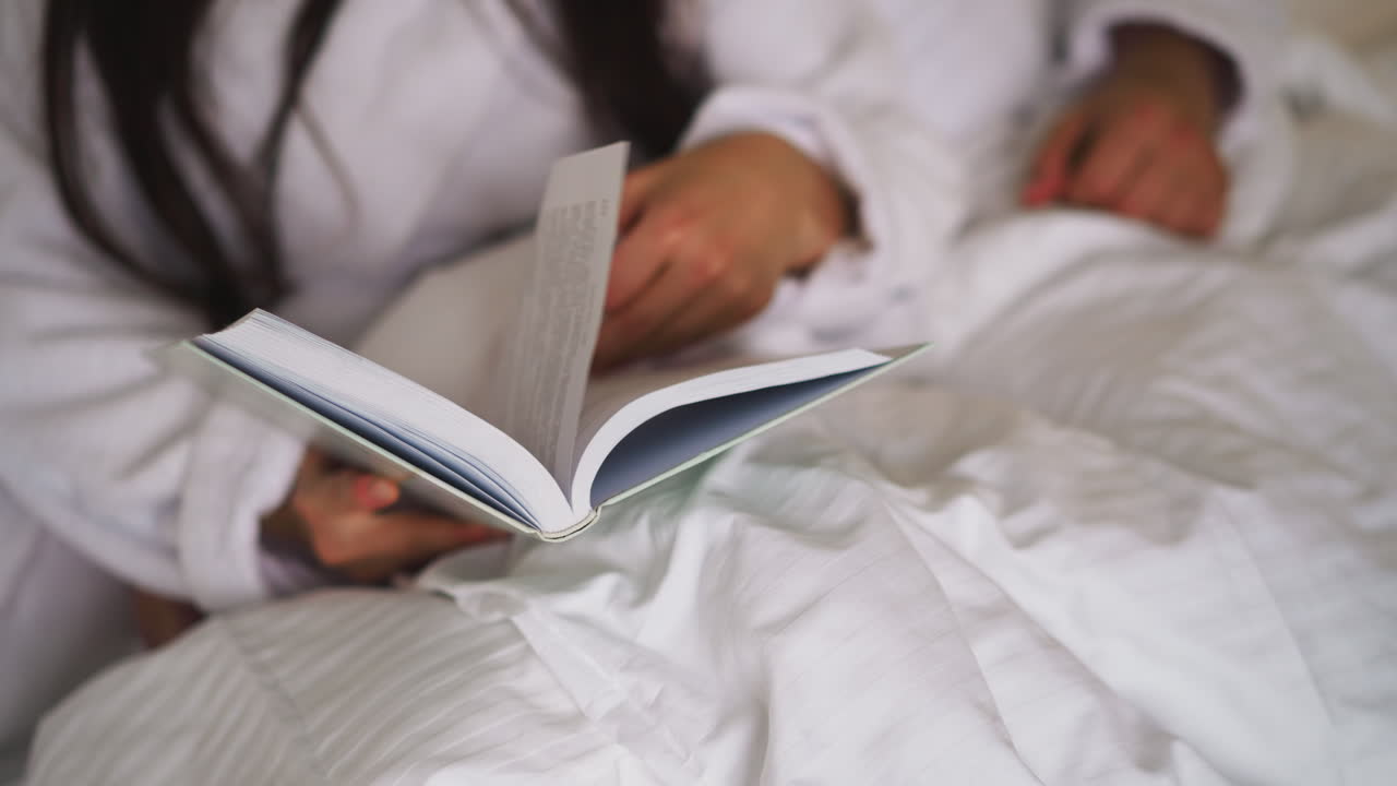 Woman Reading in Bed