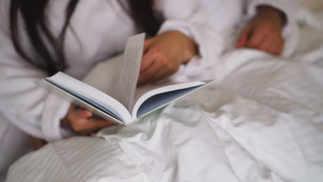 woman reading in bed