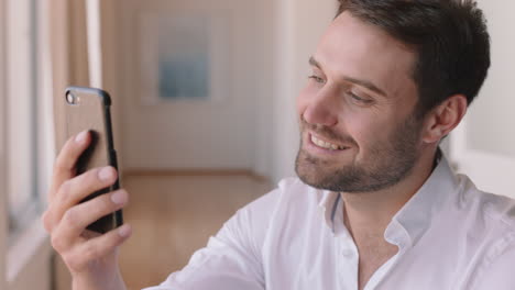 happy young man having video chat using smartphone waving hand enjoying connection chatting on mobile phone