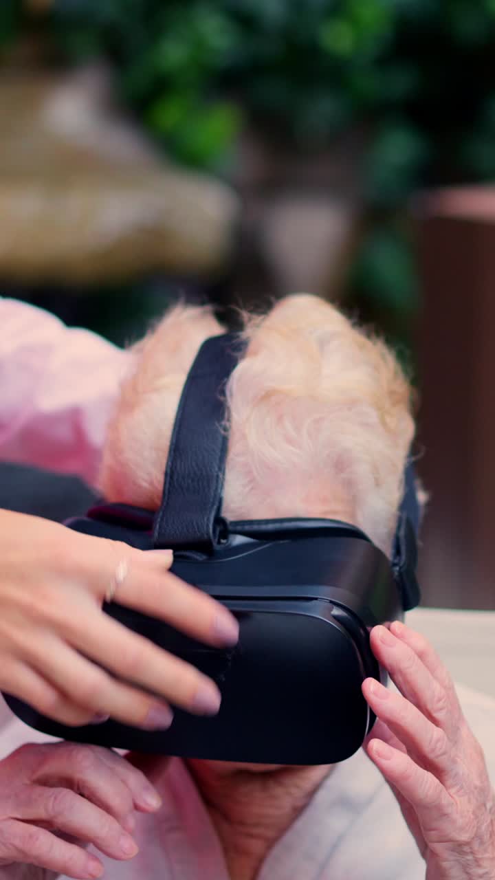 Elderly woman experiencing virtual reality with VR headset