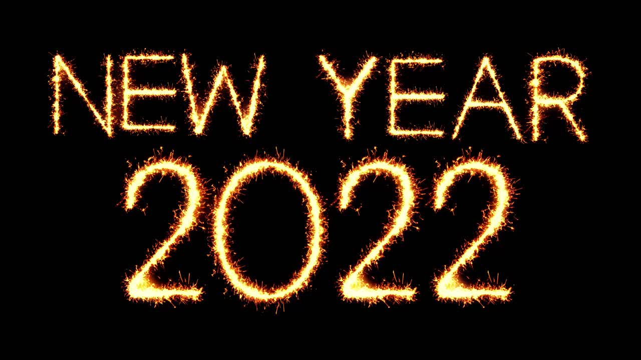 Capodanno 2022 scritta luminosa a scintilla con scintille glitterate, particelle e fuochi d'artificio su sfondo nero in loop 4K