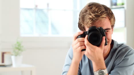 happy man taking photograph