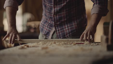 Woodworker crafting in workshop