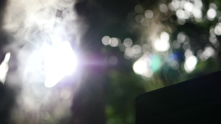 smoke from pot with bokeh sunlight