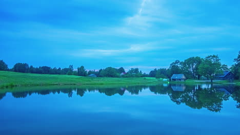 timelapse of an overcast sunrise of a lake view scene in the woodlands