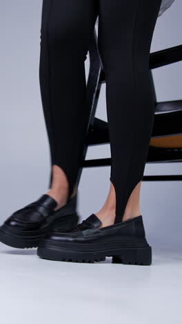 stylish black leggings and chunky platform loafers