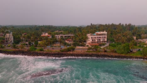stunning aerial footage showcasing the breathtaking weligama coastline and its lush jungle surroundings at sunset.