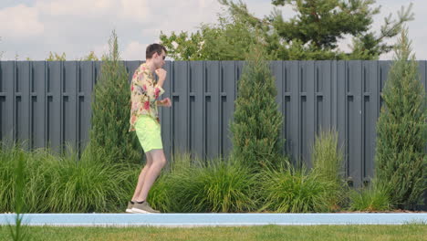 man dancing near pool