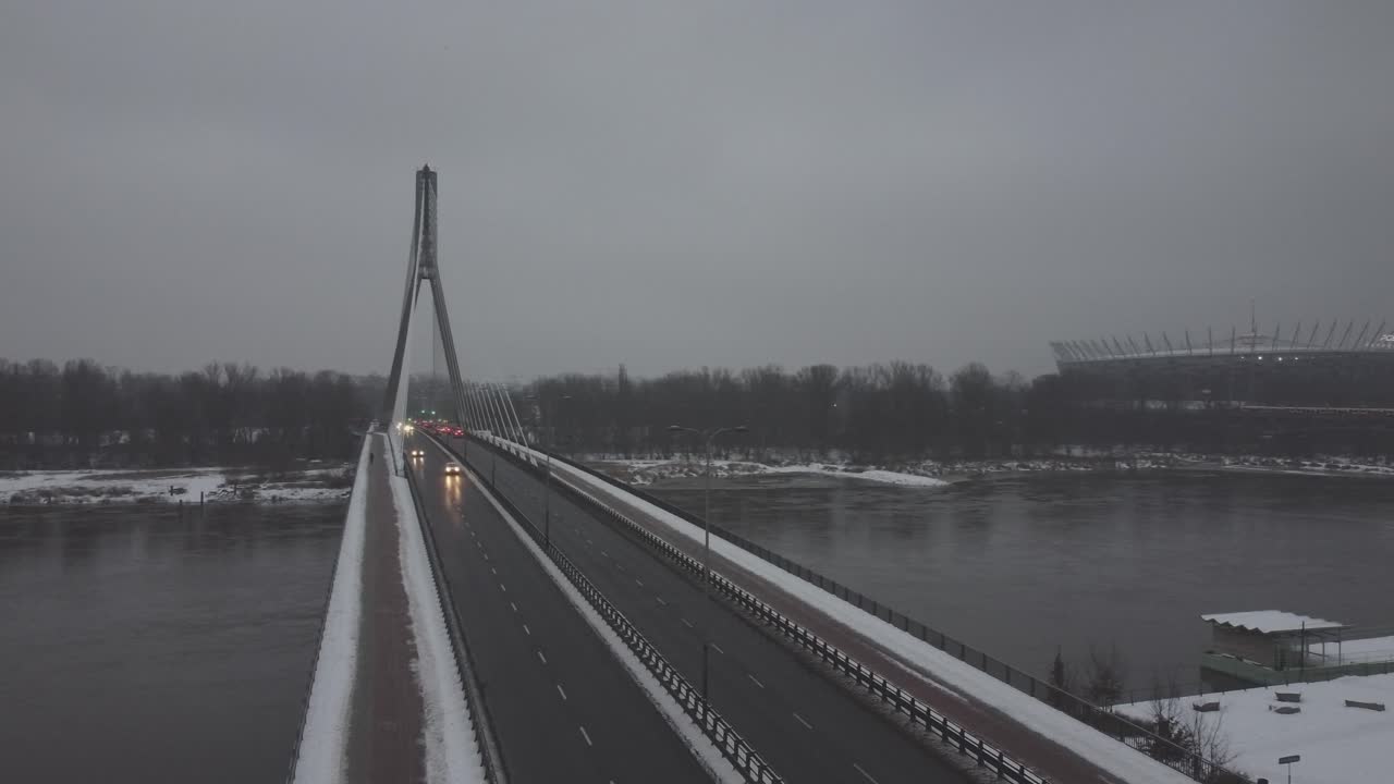 Drone video of and swietokrzsyki bridge, warsaw  above Vistula river on a  snowy day -6