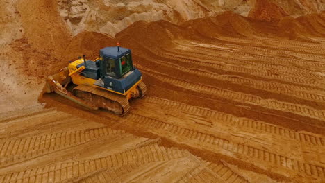 crawler bulldozer work in sand quarry. mining machinery. construction industry