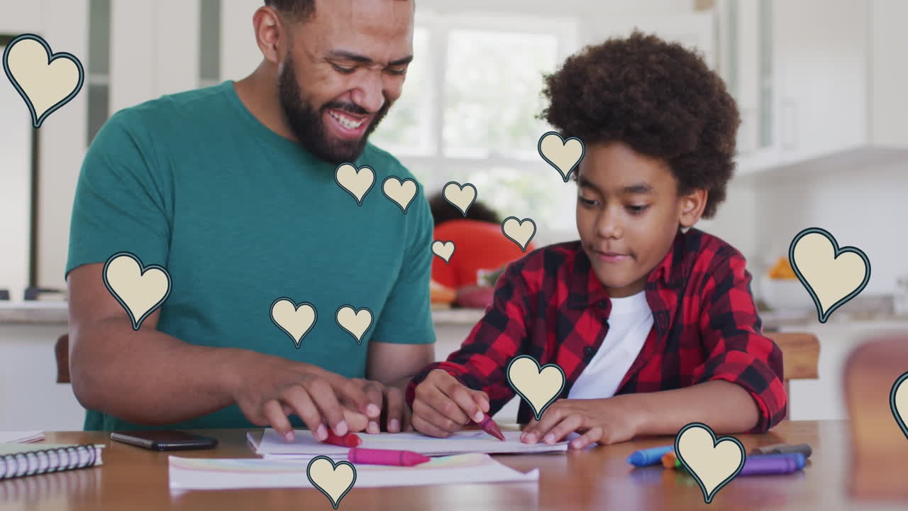 Animazione di icone a cuore dei social media su uomo birazziale sorridente e figlio che fanno i compiti