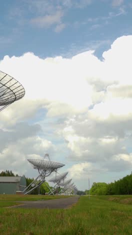 radio telescope array under a cloudy sky