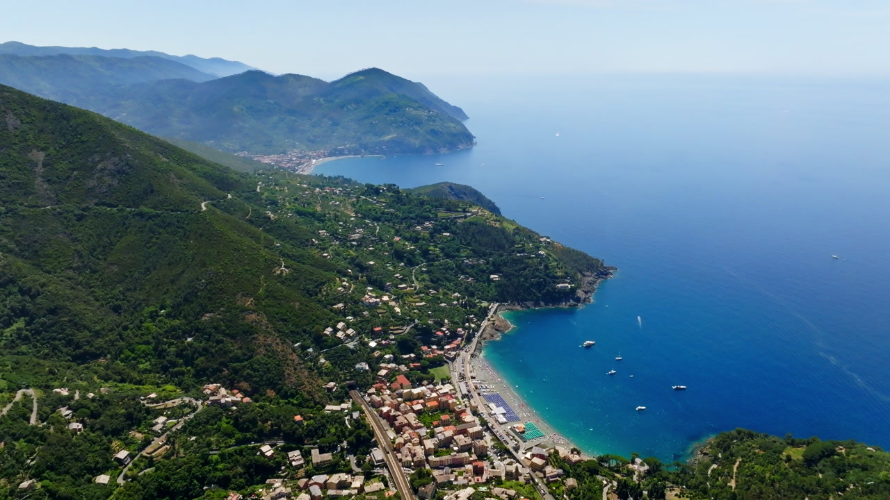 Aerial view backwards over the Bonassola village, sunny day in Liguria, Italy