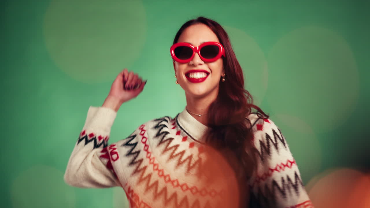 Festive woman in sweater and red sunglasses
