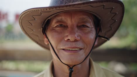smiling senior man in cowboy hat
