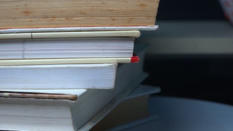 Close-Shot-of-a-Pile-of-Books-Rotating