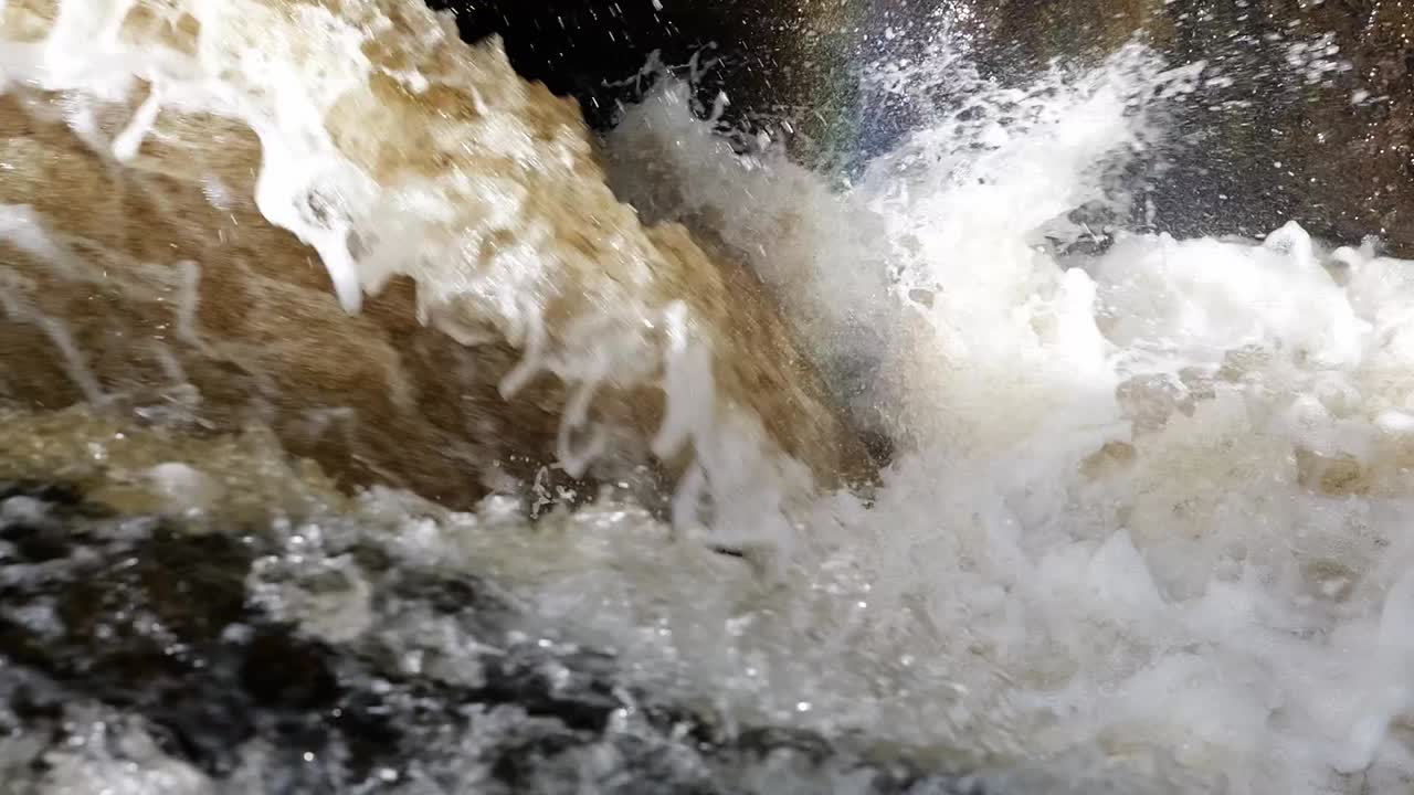 Close Up of Water Cascading Over Rocks