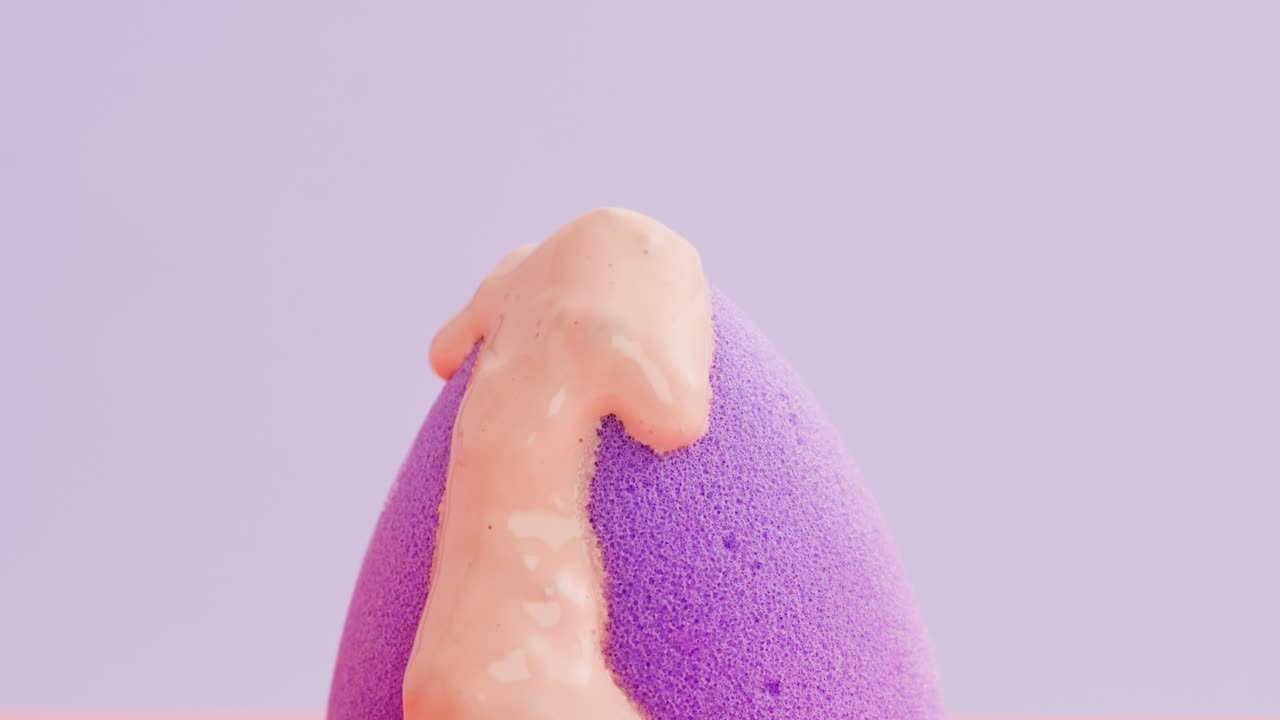Close-up of a makeup sponge with foundation