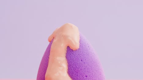 close-up of a makeup sponge with foundation