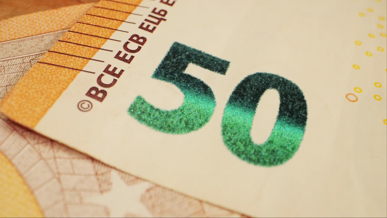 Fifty euro banknotes close-up. European currency EUR, EU Central Bank. 50 euro money macro. Economy, financial and banking concept in European union.