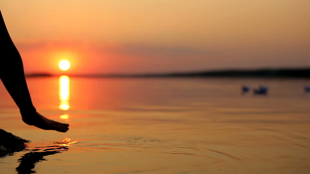 Paper Ship In Children Hand. Little boy launch paper ship on the water