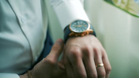 man checking wristwatch