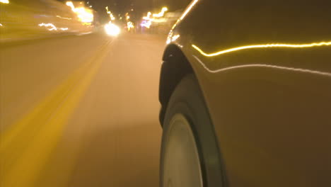 a car travels on a busy city street