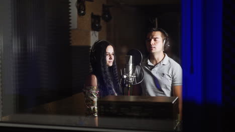 couple singing in recording studio