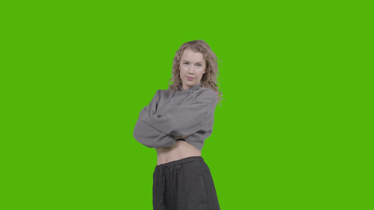 Studio Portrait Of Young Woman With Attitude Against Green Screen 1
