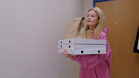 woman holding food boxes