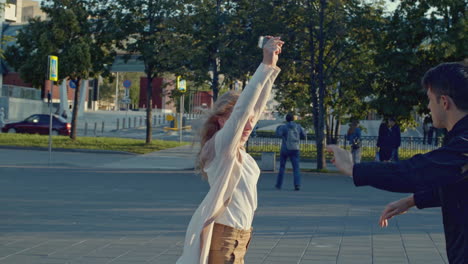 couple dancing in a city street