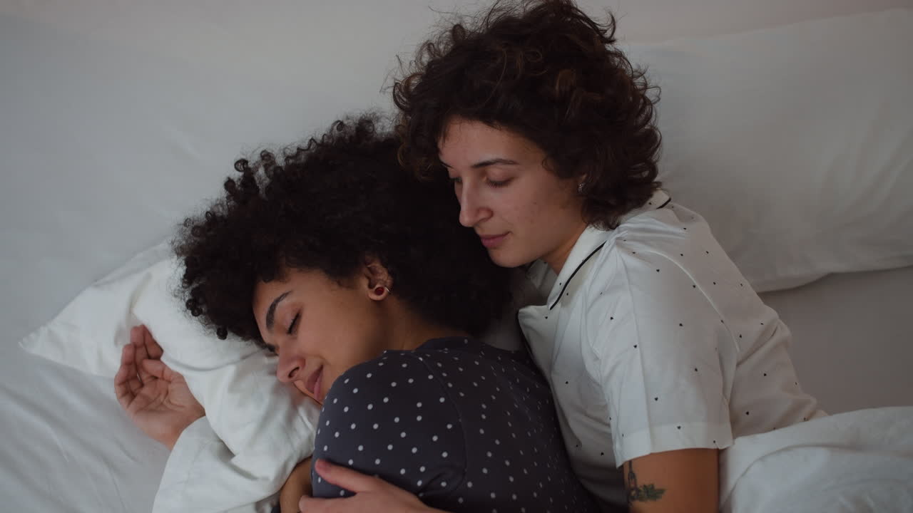 Happy couple laying on bed