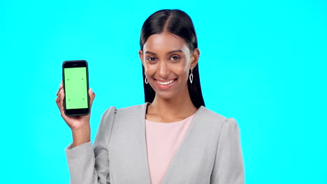 business woman holding smartphone with green screen