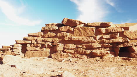 panning low angle shot of ruins at wukoki pueblo