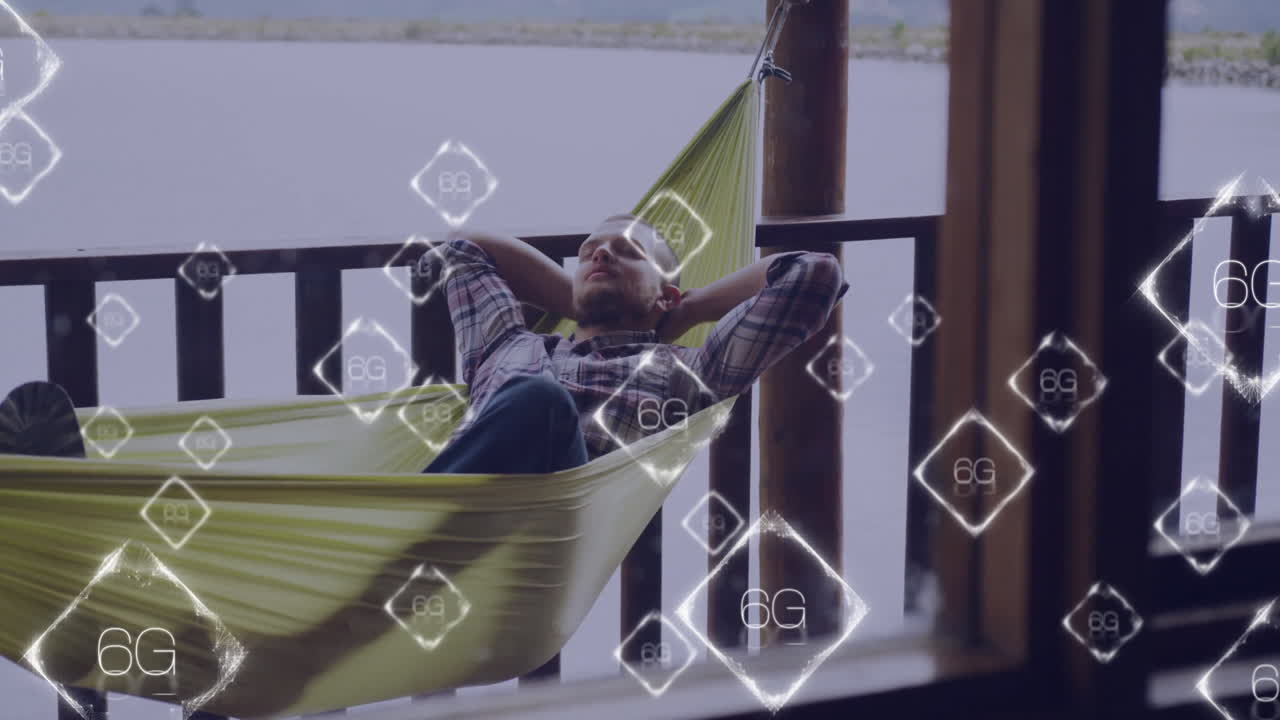 Relaxing in hammock, man using 6G technology with animation overlay