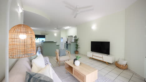Small Modern Tiled Apartment Loungeroom and Kitchen With Trendy Tropical Design Finishes and Plants