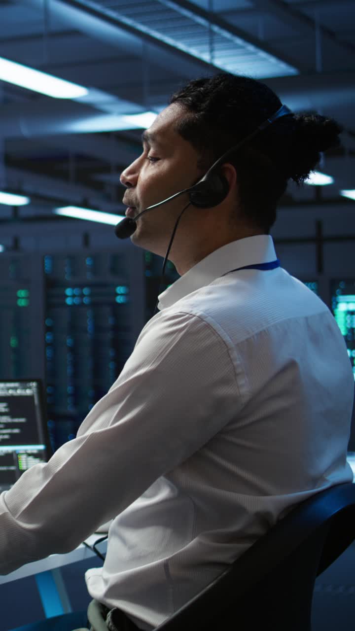 IT Professional Working with Headset in Data Center