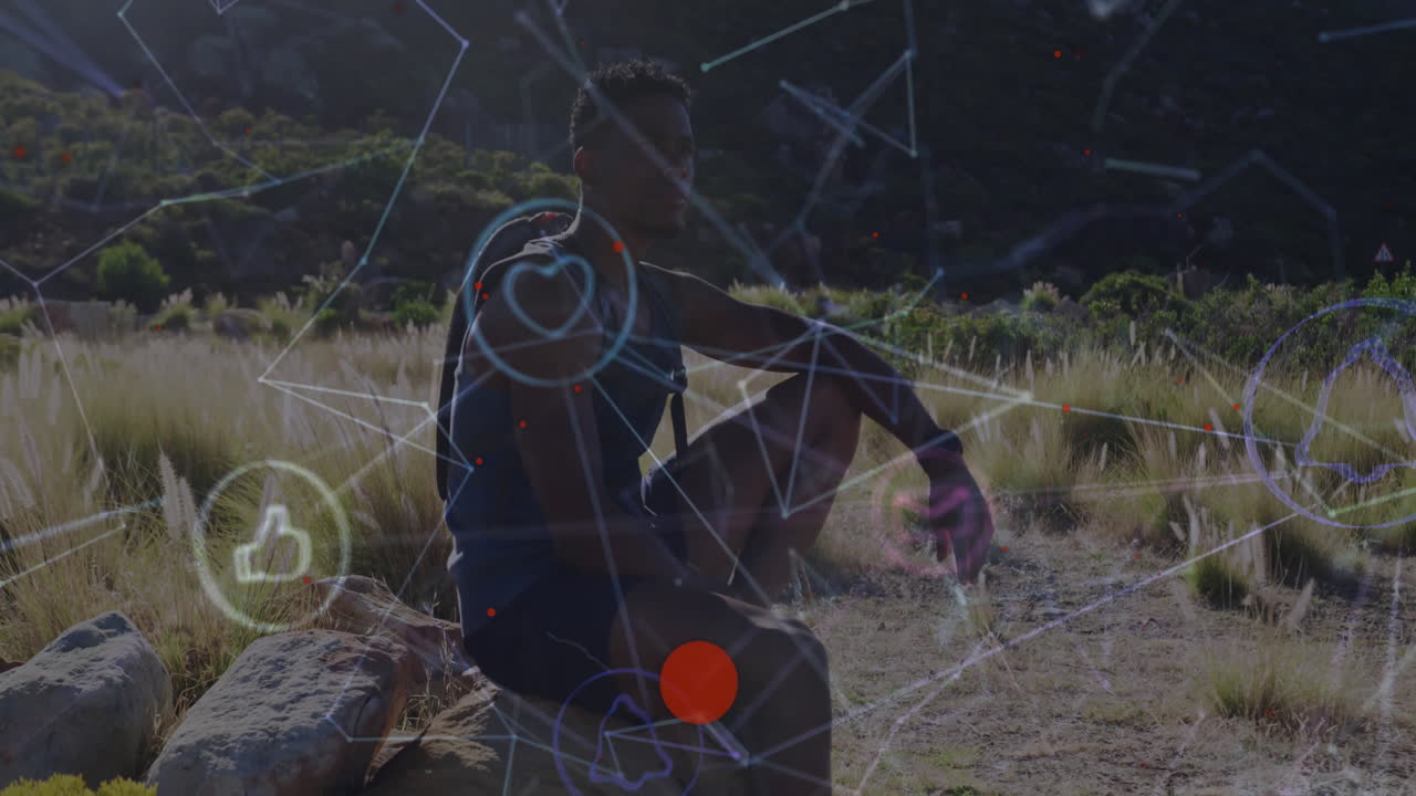 Male hiker resting on rock in nature scene, showing technology network lines and social media icons