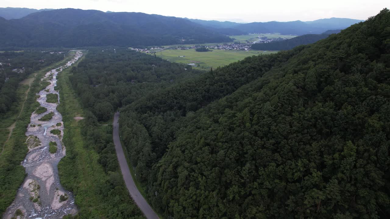 Forested Mountains Above The Matsu River Near Hakuba Resort Town In Nagano, Kitaazumi District, Japan. Aerial Drone Shot