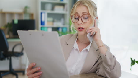 secretary talking on phone in office