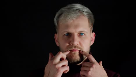 smiling man with blonde hair and blue eyes